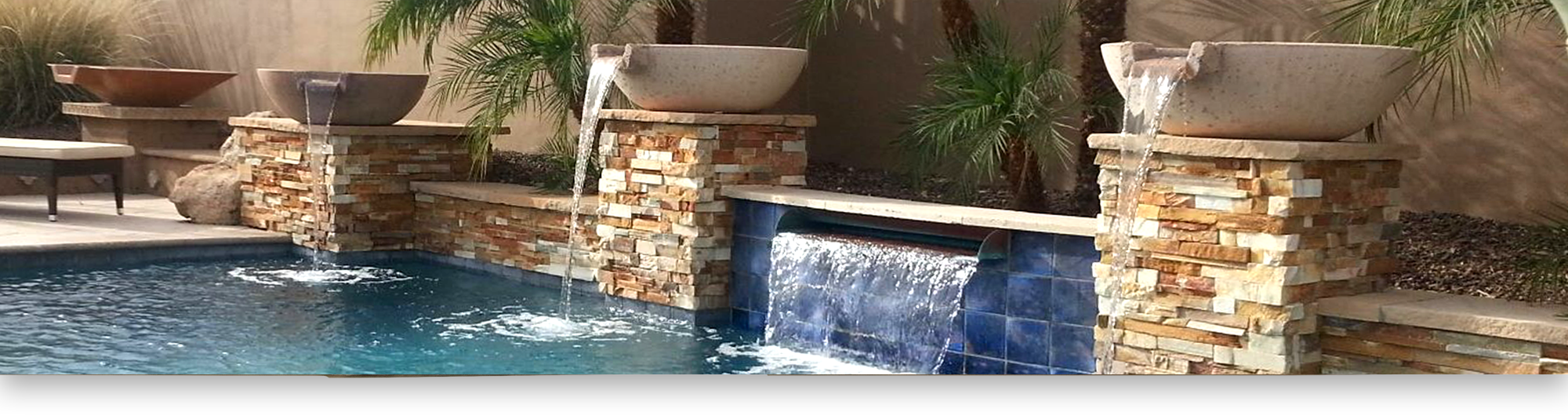 Universal Hardscape Supplies Capstone page banner-pool with columns and planters with water feature